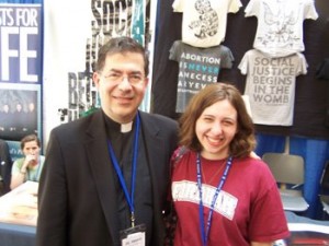 With Father Frank Pavone, of Priests for Life, at the National Right to Life Committee Convention in 2012.