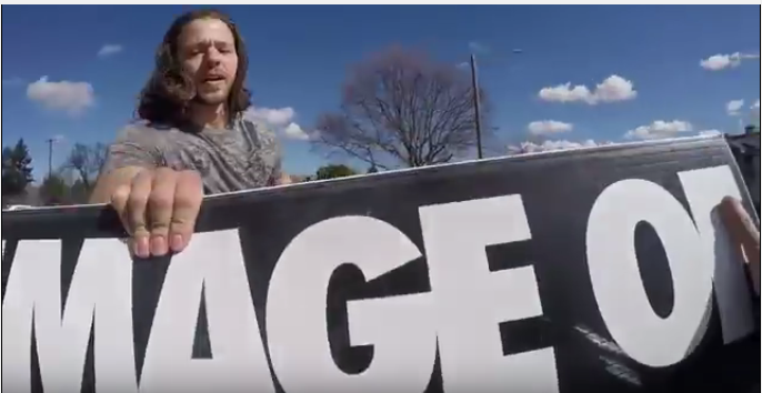 Post abortive man grabs avolitionist sign abortion prolife